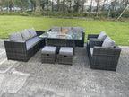 10-seater rattan garden dining set with sofa, chairs, gas fireplace table, and stools. Dark grey.